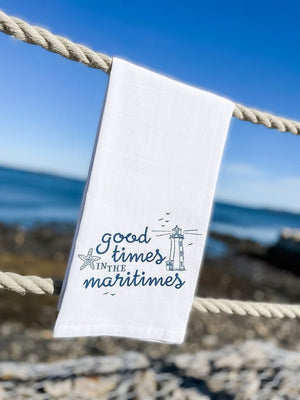 Good Times in the Maritimes Towel The Far Far Away Shop hanging on rope