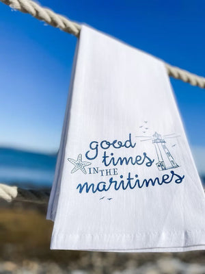 Good Times in the Maritimes Towel The Far Far Away Shop blowing in wind