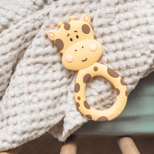 Little Cheeks Giraffe Silicone Teether on blanket