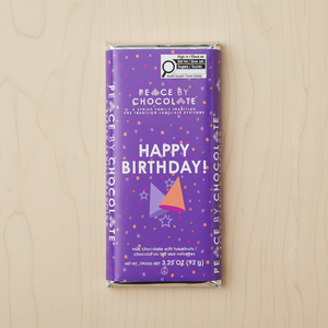 happy birthday peace by chocolate bar on table