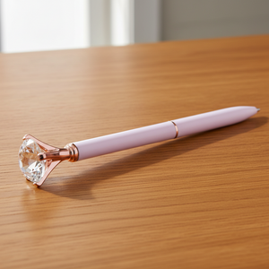 pink pen with gem on table