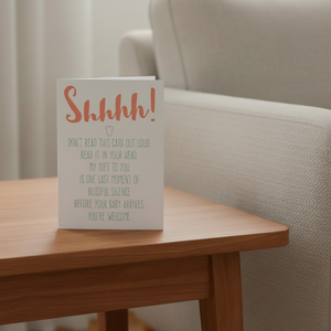 Shhhh Baby Shower Card on end table beside couch