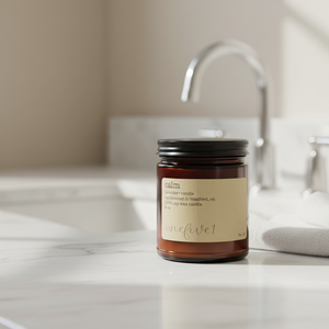 Soy candle labeled 'calm' in bathroom