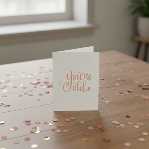 Stevie and Bean Old AF Card on table with confetti