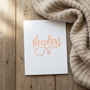 Stevie and Bean Sleepless AF card on table beside beige blanket