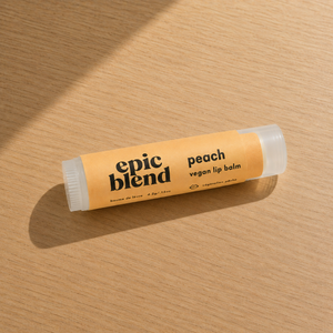 Vegan peach lip balm Epic Blend on table