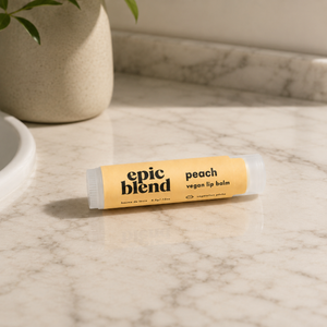 Vegan peach lip balm Epic Blend on counter