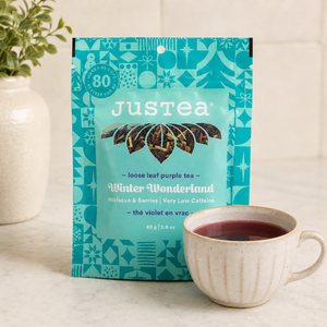 Justea Winter Wonderland loose leaf purple tea with teacup