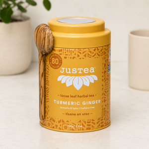 Justea Turmeric Ginger tea container on counter