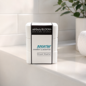 Breathe Shower Steamers by Ashbury Bloom on edge of tub