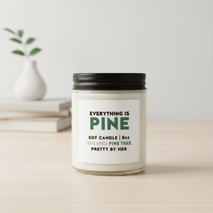 Everything is pine soy candle pretty by her on desk