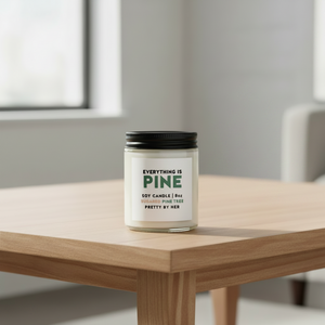 Everything is pine soy candle pretty by her on coffee table