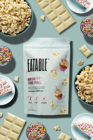 Eatable Birthday Cake Pops Popcorn surrounded by treats