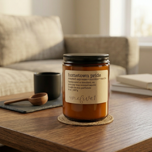 Hometown pride soy candle onefive1 on coffee table