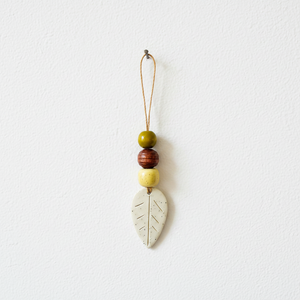 Fall leaf ornament hanging on nail