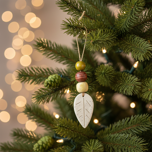 Fall leaf ornament hanging on Christmas tree