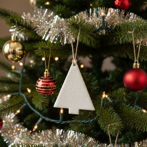 Minimalist Christmas tree ornament on tree