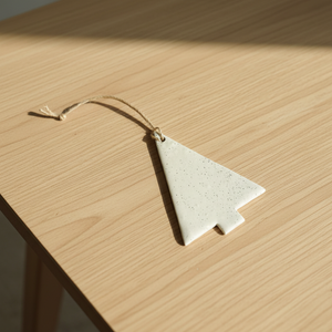 Minimalist Christmas tree ornament on table