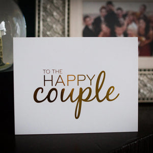 Happy Couple Card Wrinkle and Crease in front of wedding photo