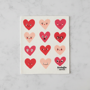 Dishcloth with heart designs on a marble surface