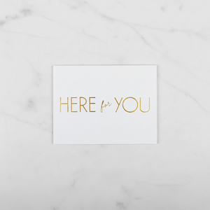 Here For You Card lying flat on marble table
