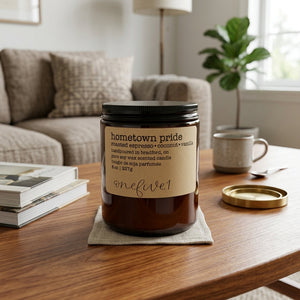 Hometown pride soy candle onefive1 on living room table