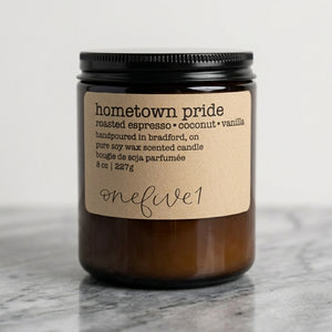 Hometown pride soy candle onefive1 on marble surface