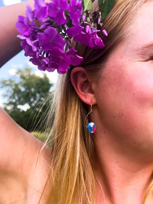 Made in Nova Scotia earrings on woman's ear