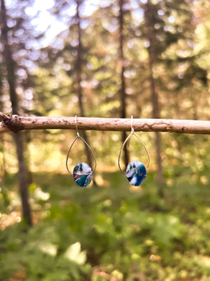 Made in Nova Scotia earrings hanging on branch