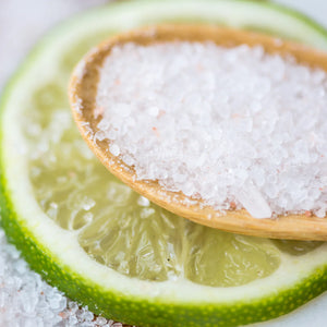 Anointment pink grapefruit and lime bath soak in spoon on lime
