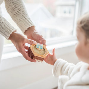 Anointment Baby Calendula Soap handed from mom to baby
