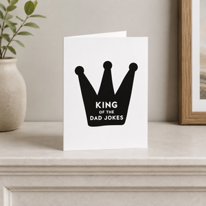 King of the Dad Jokes card Pretty by Her on mantle