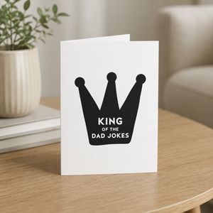 King of the Dad Jokes card Pretty by Her on table