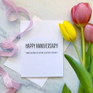 Stevie and Bean Happy Anniversary Card beside tulips