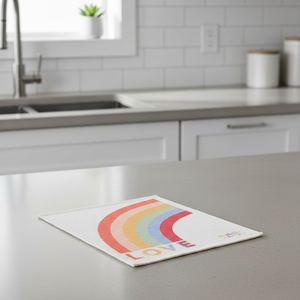 Rainbow love is love Swedish dishcloth on kitchen counter