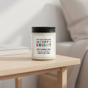 Merry and Bright soy candle Pretty by Her on bedside table