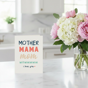 Mother Mama card on kitchen island beside floral bouquet