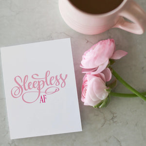 Sleepless AF Card Stevie + Bean beside flowers and mug