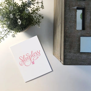 Sleepless AF Card Stevie + Bean beside plant