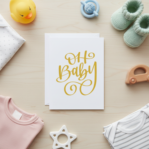 Oh Baby Card Stevie and Bean surrounded by baby clothes and toys