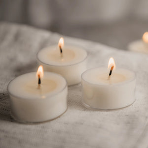 Natura Soy Tealights three candles lit up