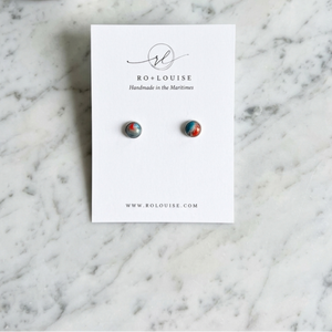 Nova Scotia stud earrings on bathroom counter