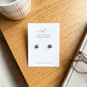 Nova Scotia stud earrings on bedside table