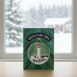 Holiday wishes from Nova Scotia Christmas Card in front of snowy window