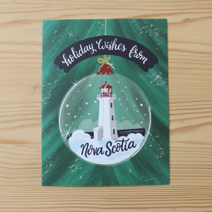 Holiday wishes from Nova Scotia Christmas Card on table