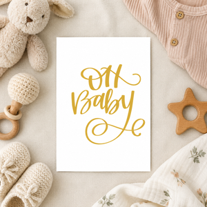 Oh Baby Card Stevie and Bean surrounded by baby clothes and toys