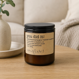 OneFive1 You Did It Candle on coffee table