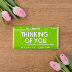 Peace by Chocolate Thinking of You chocolate bar beside tulips