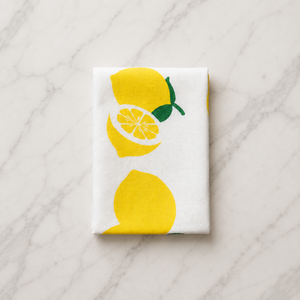 Plantish lemon tea towel folded on kitchen counter