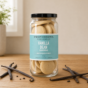 Provisions Vanilla Bean Shortbread Cookie Jar on table with vanilla beans